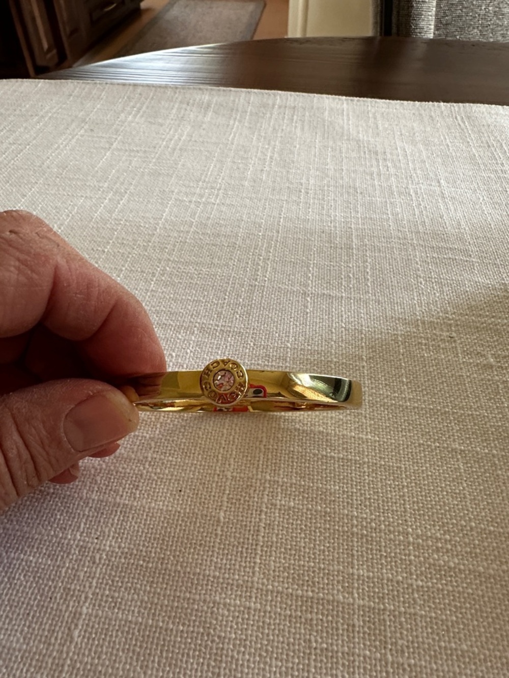 Coach Gold-Tone Crystal Medallion Bangle Bracelet